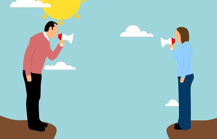 No fault divorce: A cartoon of a man and a woman yelling with megaphones at each other