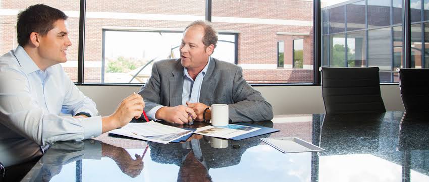 2 businessmen going through the process of how to negotiate a commercial lease agreement