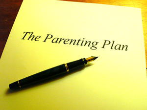 What is a parenting plan? Picture of parenting document with fountain pen resting on top